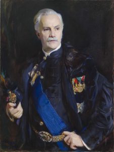 Portrait of man wearing a sash and decorations including a series of medals