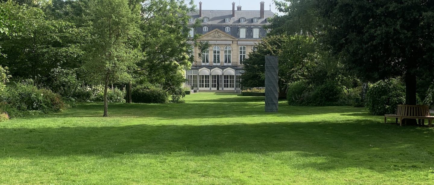 A view of the garden at the British Ambassador's Residence in Paris on a sunny day.